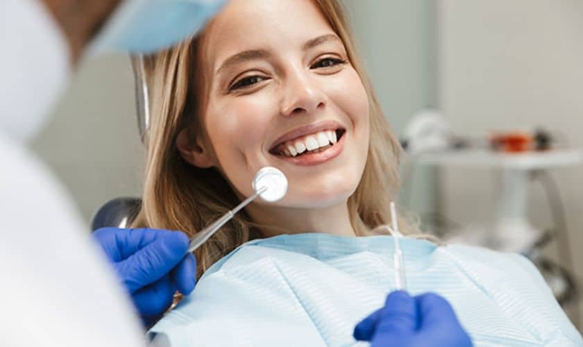 Young patient smiling during dental cleaning appointment with dentist in Tempe.