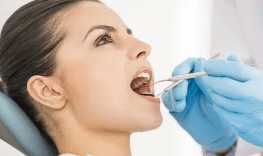 Patient receiving cosmetic dental examination from dentist in Tempe.