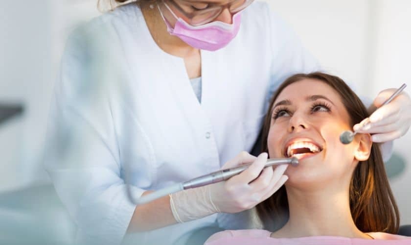 Dentist examining patient's teeth during a dental checkup in Tempe.